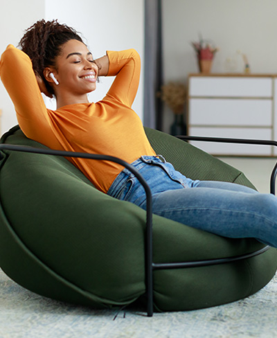 calm woman sitting in beanbag chair