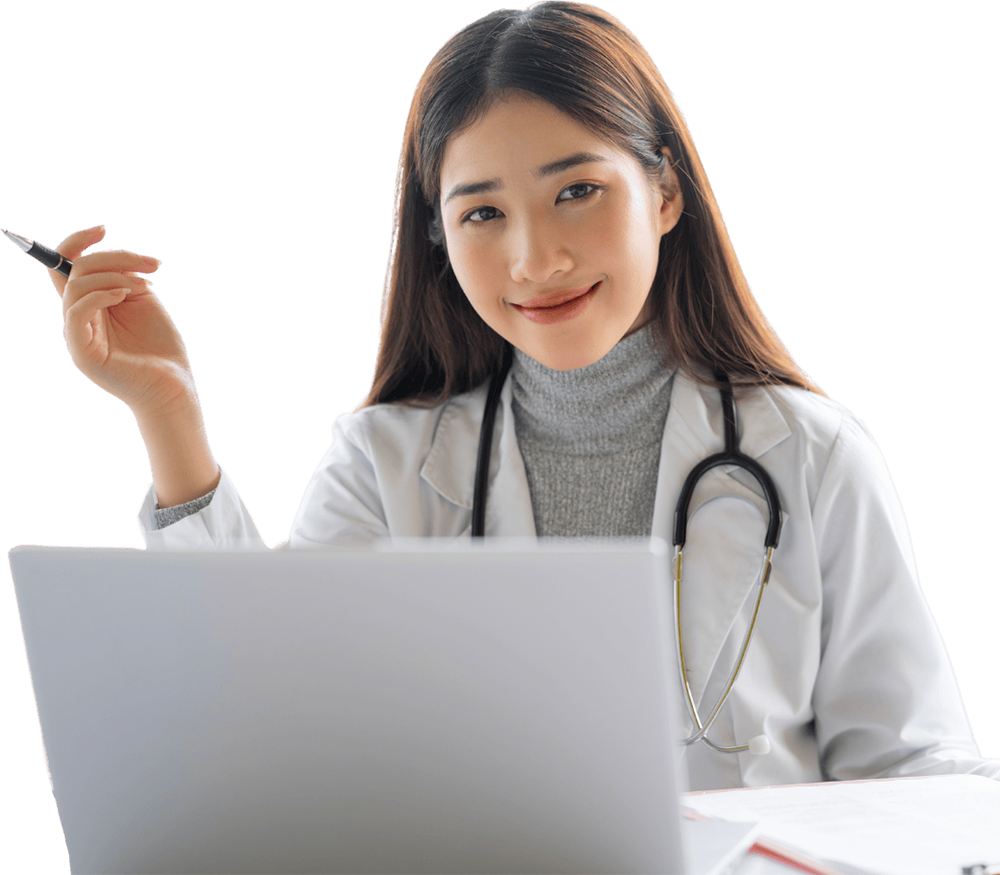 a healthcare provider sitting at a laptop