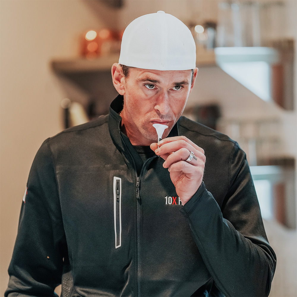 a man collecting a sample for a 10X Health Precision Genetic Test