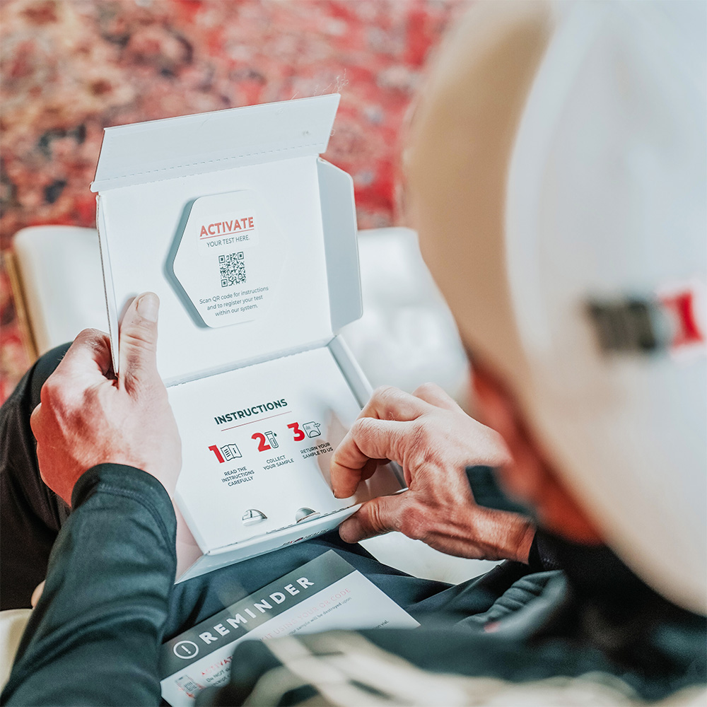 a man reviewing the 10X Health Precision Genetic Test instructions