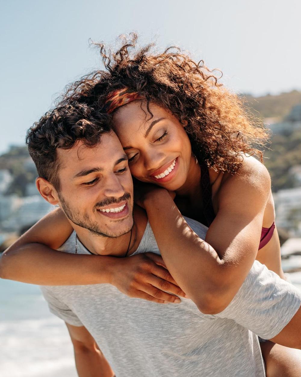 a couple smiling at the beach a couple smiling at the beach