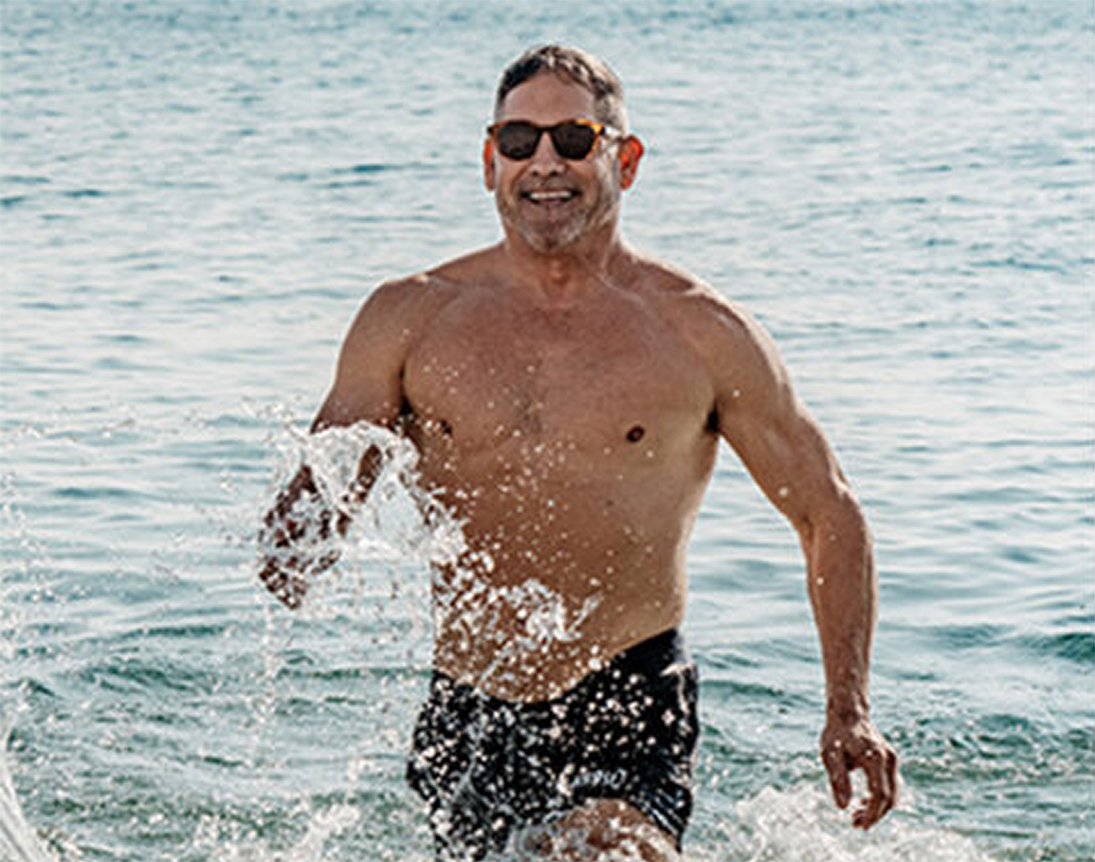 Grant Cardone walking in the ocean Grant Cardone walking in the ocean