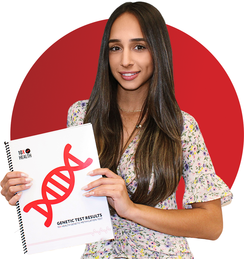 a woman smiling while holding her 10X Health Genetic Test results booklet a woman smiling while holding her 10X Health Genetic Test results booklet
