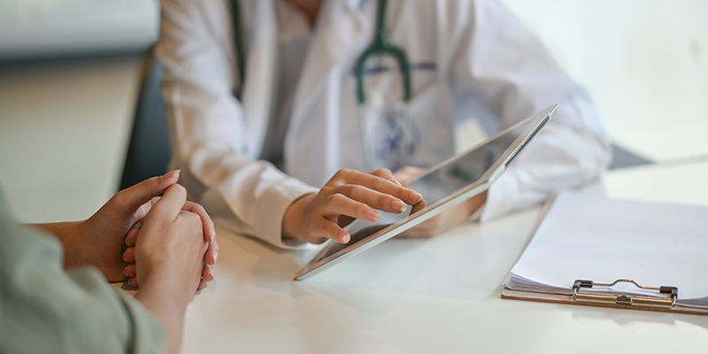 a 10X Health System clinician reviewing results on a tablet