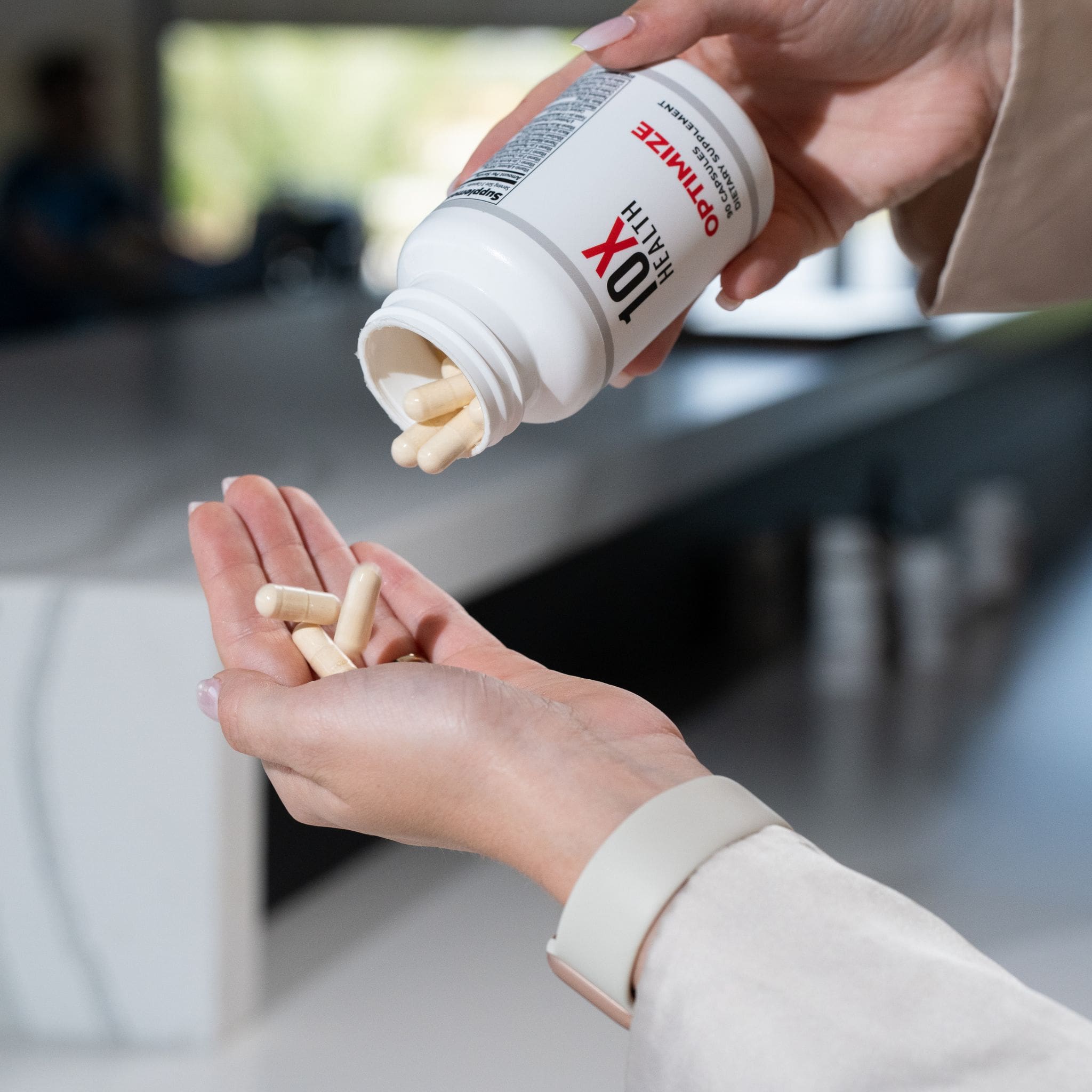a woman taking 10X Health Optimize supplements