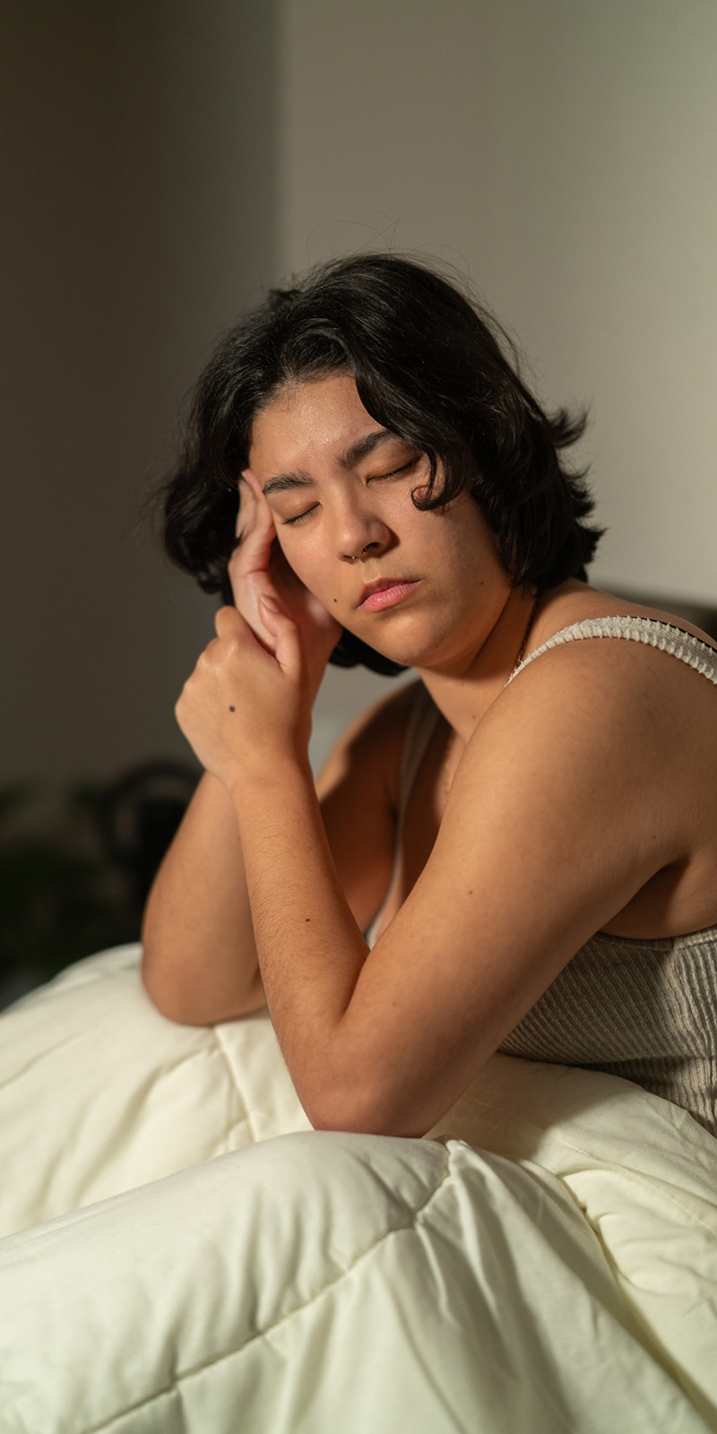 a woman in bed having trouble sleeping