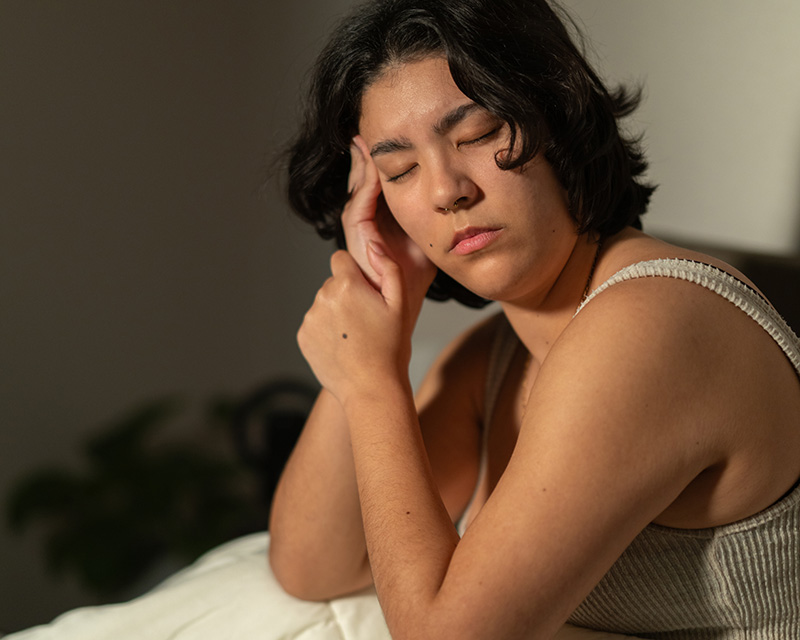 a woman in bed having trouble sleeping