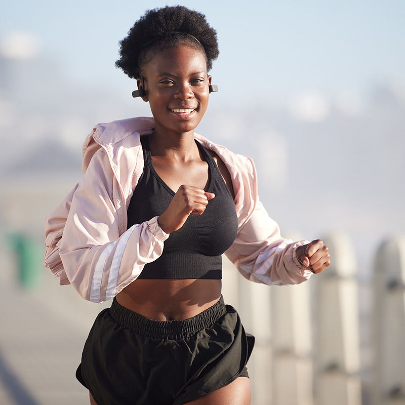 an athlete powered by 10X Health running outdoors