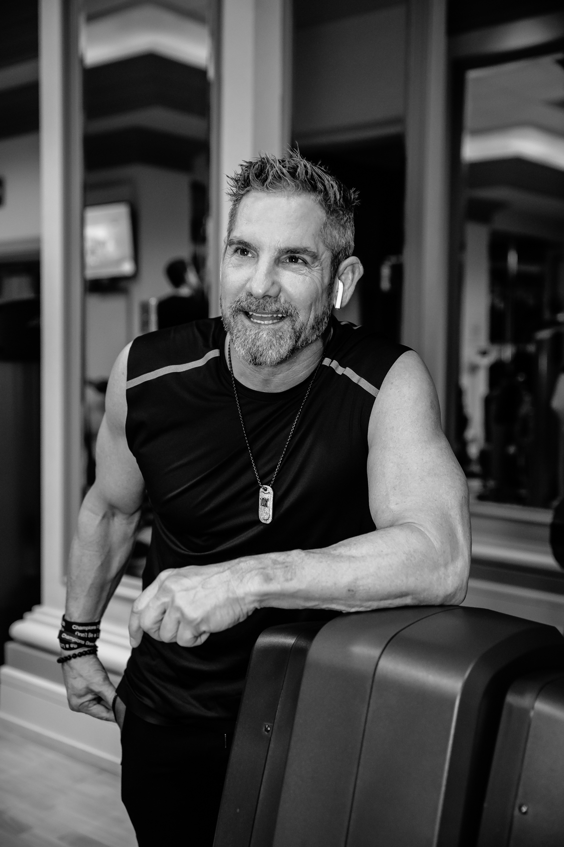  Grant Cardone of 10X Health working out in the gym in a black and white photo